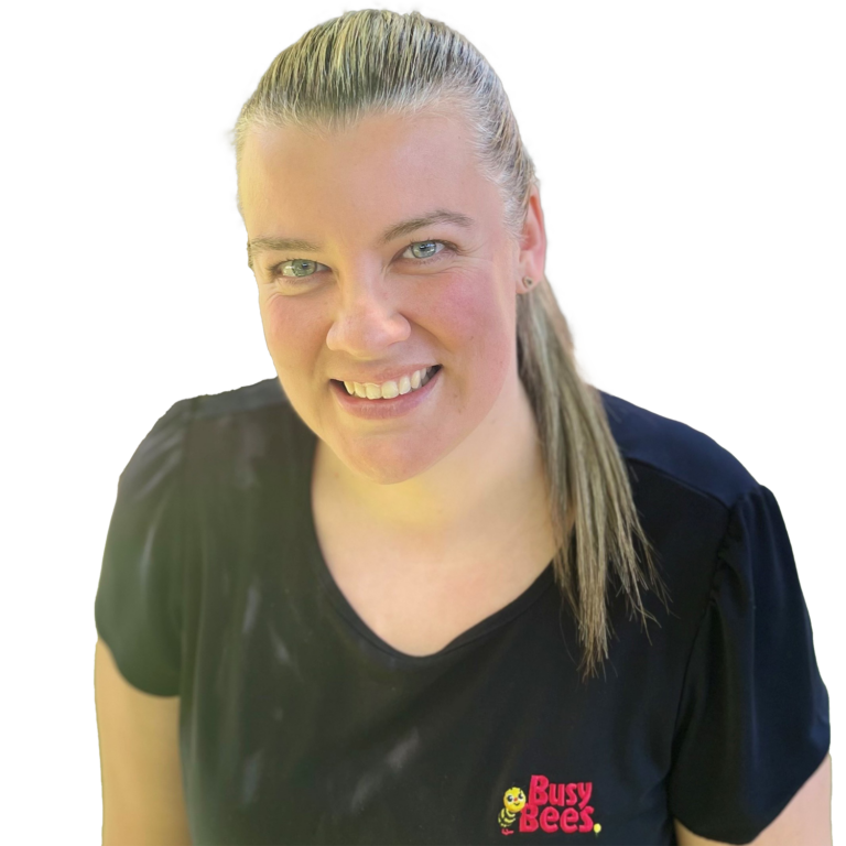 Rebecca Greig the Assistant Manager of Jenny Wren Early Learning, wearing a black shirt with the Busy Bees logo, smiling at the camera.
